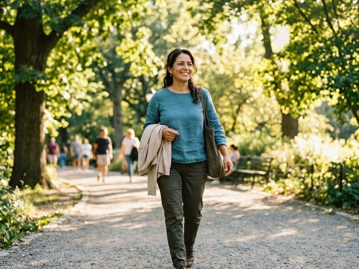Indian woman enjoying a comfortable walk outdoors in soft morning light.